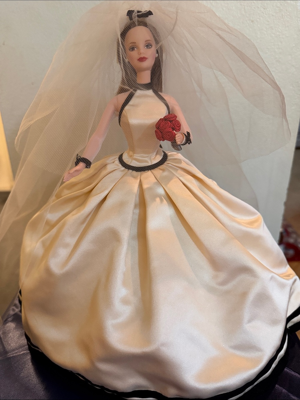 VERA WANG BARBIE BRIDE DRESSED IN A CREAM SATIN GOWN TRIMMED IN BLACK VELVET